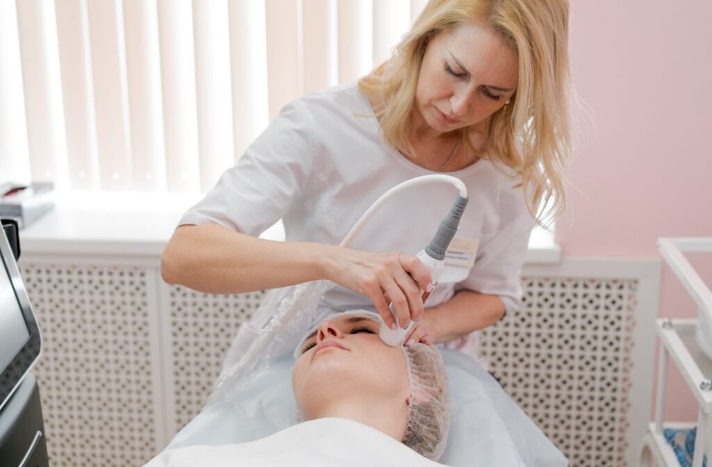 A female patient undergoing a radiofrequency treatment for her dry eye syndrome.